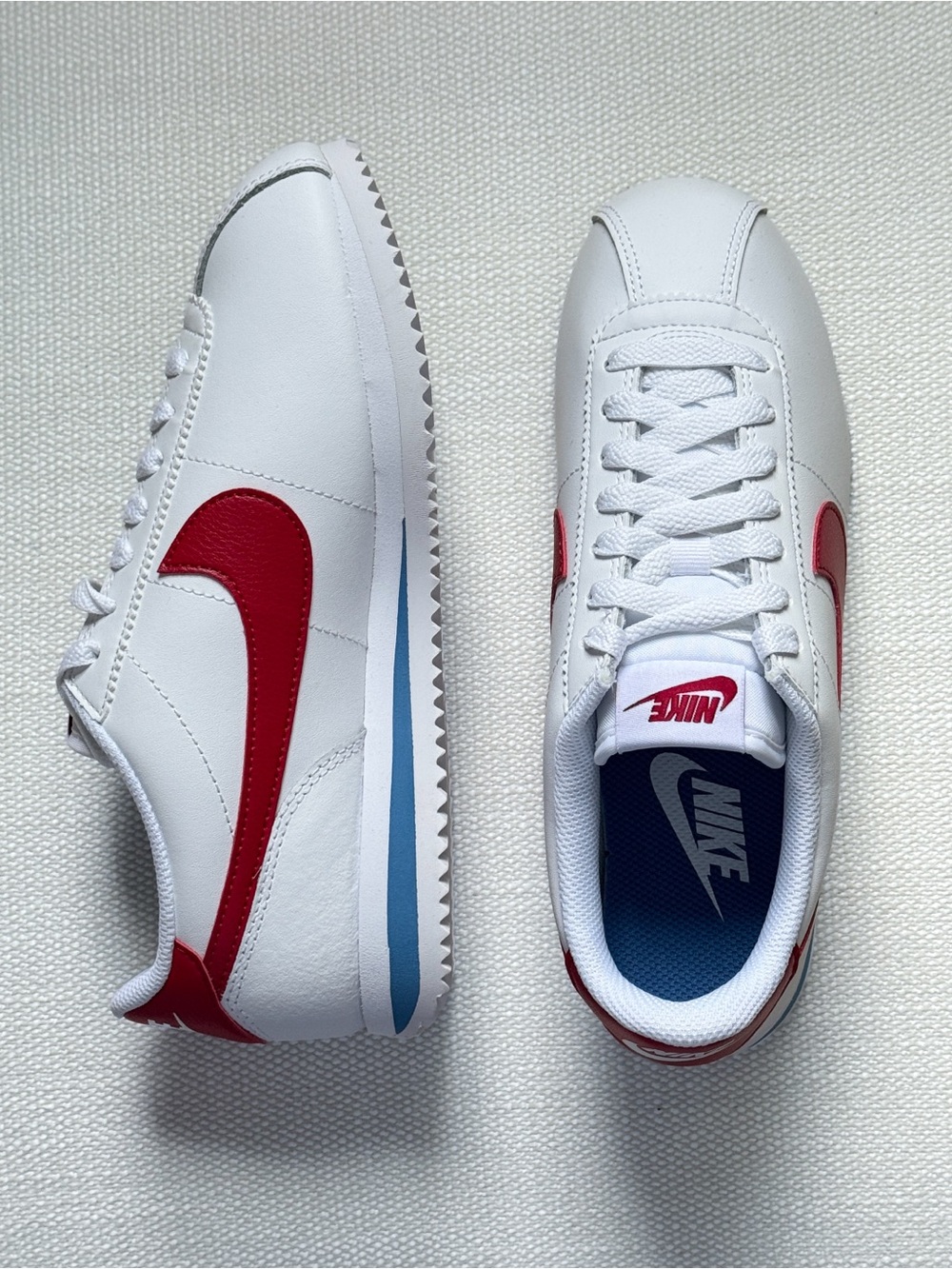 Nike Women’s Cortez Sneakers in White with Red Swoosh